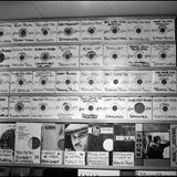 Reggae record sleeves on the wall at Dub Vendor, Clapham Junction, London, 1988
