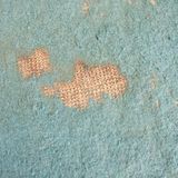Staring at the worn carpet